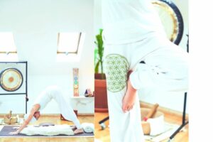 Woman practicing Kundalini yoga in standing and downward facing dog poses