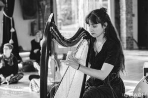 woman playing harp